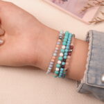 Model wearing the Lucky Horizon good luck bracelet stack, attracting positivity and fortune through turquoise energy.2