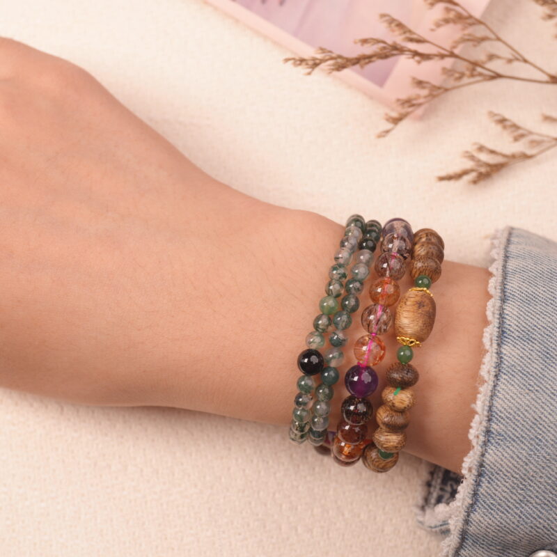 Model wearing the wealth crystal bracelet stack — a daily charm for success and good fortune.1