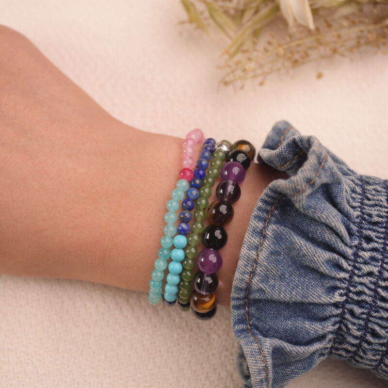 Model wearing the protection crystal bracelet stack — a daily reminder of calmness, strength, and inner harmony.1