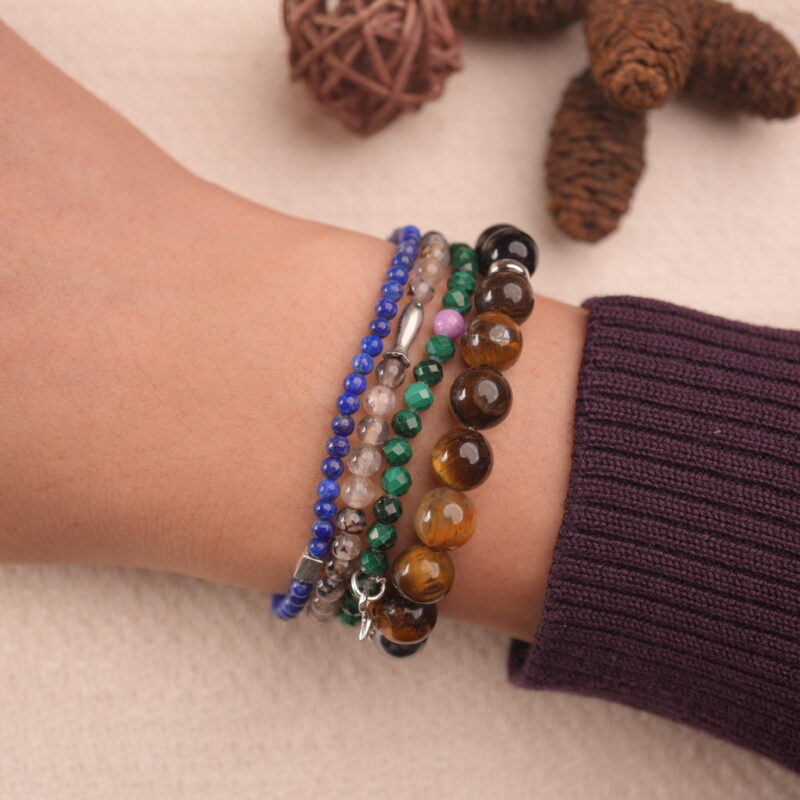 Model wearing the protection crystal bracelet stack — a daily reminder of calmness and inner strength.1