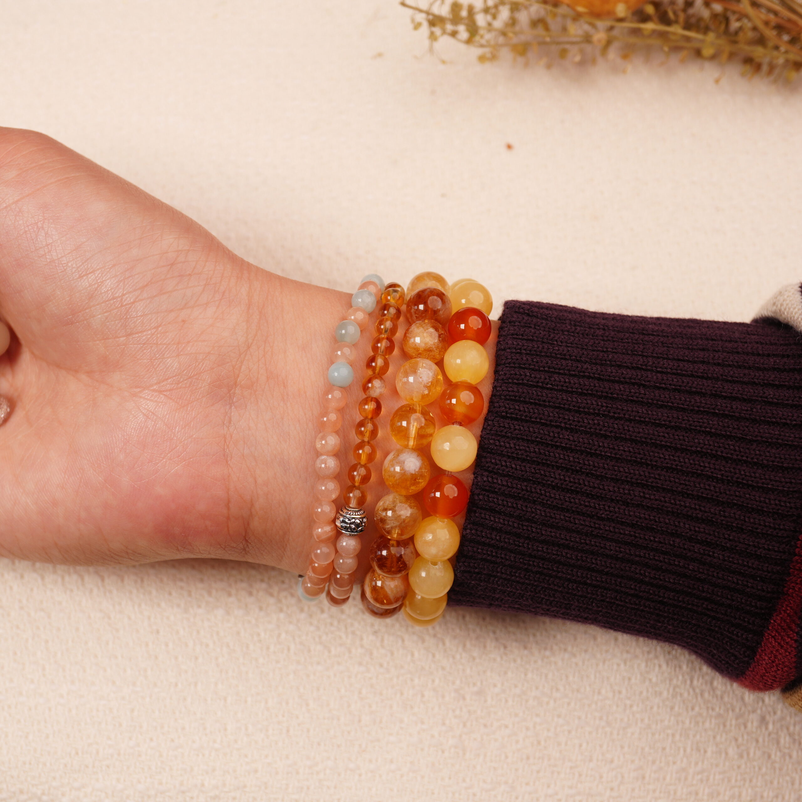 golden-glow-wealth-bracelet-stack-on-wrist.jpg2 Model wearing the Golden Glow wealth bracelet stack — a daily charm for abundance and good fortune.2