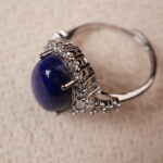 A close-up view of the Lapis Lazuli ring, showcasing the smooth and rich blue stone at the center, framed by intricate silver detailing that adds sophistication to the design.