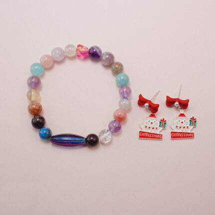 Multicolor gemstone bracelet featuring amethyst, rose quartz, and more, paired with Santa Claus earrings with red bows and Christmas gifts.