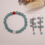A serene scene with the green chalcedony bracelet and carnelian accent, paired with the matching earrings, perfect for a peaceful and balanced vibe.