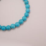 Close-up of Turquoise Bracelet with Red Agate and White Accent - Detail Image