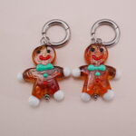 Close-up of Gingerbread Man Earrings with Turquoise Bow - Detail Image