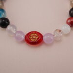 Close-up of Multi-Gemstone Bracelet with Christmas-Themed Beads - Detail Image