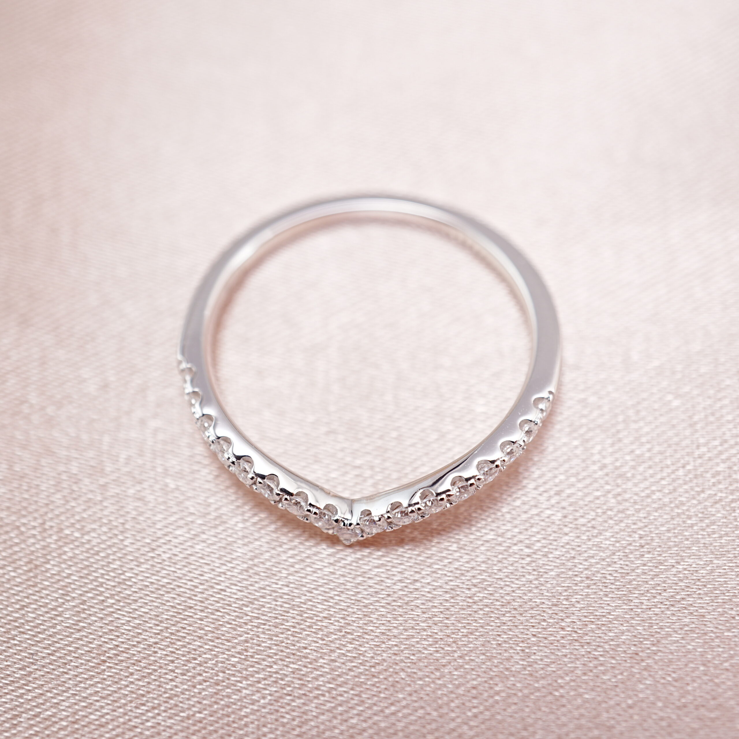 v-shape-s925-moissanite-ring-main.jpg s925 V-shaped ring with moissanite stones displayed on soft background