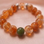 Close-up of citrine bracelet with silver spiral detail, highlighting its natural crystal clarity and golden hue.