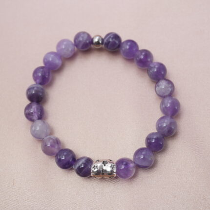 Amethyst bracelet with silver accent bead symbolizing peace, clarity, and protection.