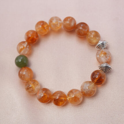 Citrine bracelet with silver spiral beads, symbolizing wealth, vitality, and positive energy.