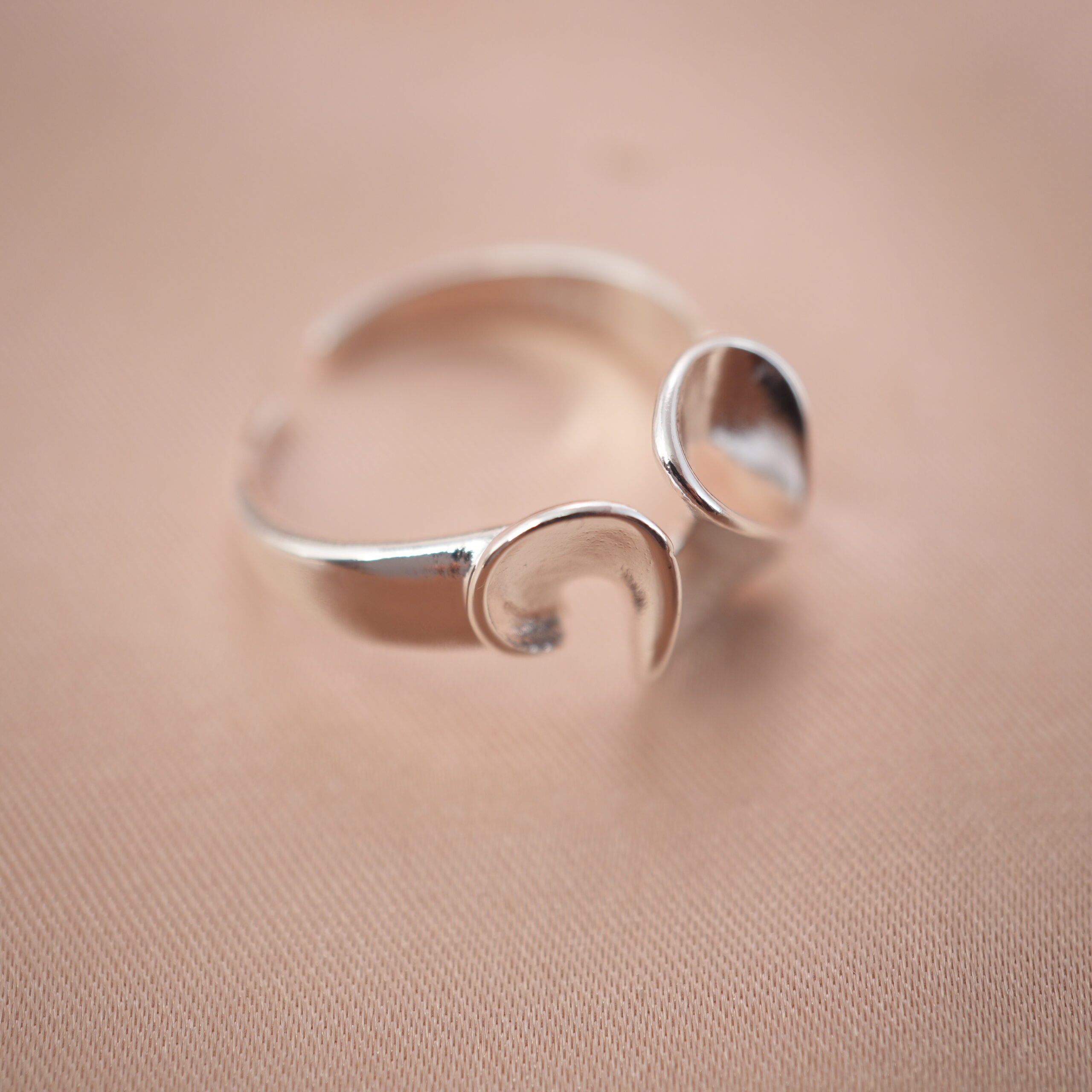 silver-petal-open-ring-main.jpg Silver open ring with petal-inspired design, symbolizing elegance and grace.