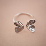 Top view of open butterfly wing silver ring showing fine details and artistic symmetry.