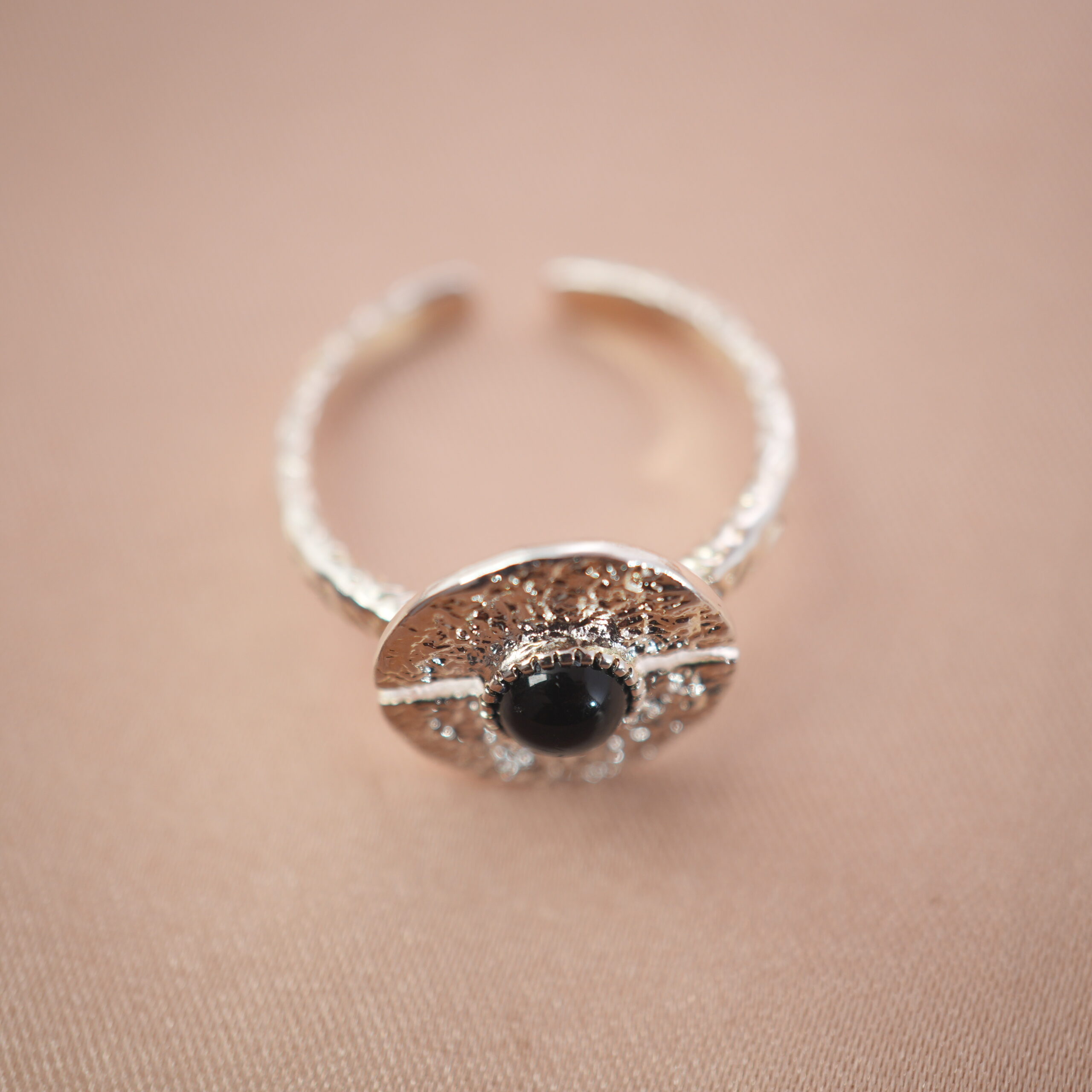 silver-evil-eye-obsidian-ring-main.jpg Silver evil eye adjustable ring featuring an obsidian center stone for grounding and protection.