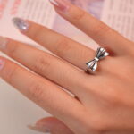 Model wearing the vintage bow silver ring, showing its cute and elegant feminine charm.