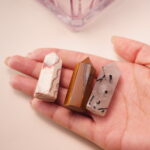 Three crystal points – red jasper, tiger’s eye, and tourmalinated quartz – held together, radiating balance and harmony.