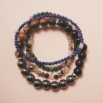 Protection crystal bracelet stack designed for grounding, strength, and emotional balance.