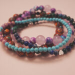 Angled view of the good luck bracelet stack symbolizing positivity, joy, and fortune.