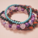 Close-up of the good luck bracelet stack showing harmonious colors and radiant energy flow.