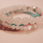 Angled view of the love bracelet stack symbolizing connection, tenderness, and emotional balance.