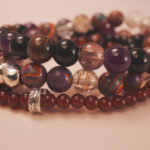 Charm detail from the Flame Spirit bracelet stack, representing fire energy and confident spirit.