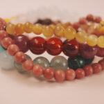 Heart charm detail from the Blossom Heart bracelet stack symbolizing love, care, and emotional warmth