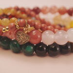 Close-up of the Blossom Heart bracelet stack showing soft pink hues and romantic gemstone glow