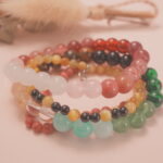 Blossom Heart bracelet stack displayed in soft natural light, radiating warmth and affection.