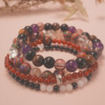 Colorful vitality bracelet stack displayed in warm natural light, embodying motivation and life energy.