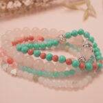 Love bracelet stack displayed in a soft natural setting, radiating calm and affectionate energy.