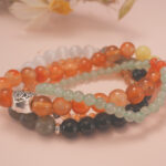 Solar Energy bracelet stack displayed under warm natural light, radiating joy and powerful energy.