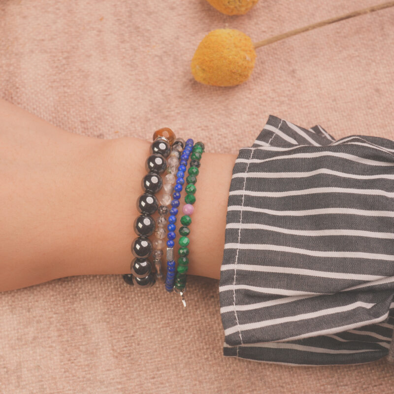 Model wearing the protection crystal bracelet stack — a daily reminder of calmness and inner strength.