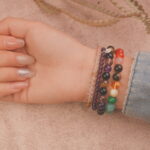 Model wearing the Rainbow Fortune bracelet stack — a daily charm for confidence, joy, and good luck.