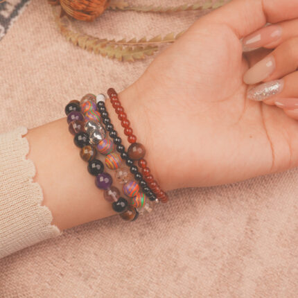 Model wearing the Flame Spirit vitality bracelet stack, radiating energy and fearless charm.