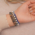 Model wearing the Midnight Guardian bracelet stack — a symbol of calm strength and inner protection.