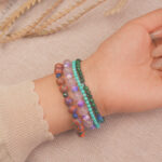 Model wearing the good luck crystal bracelet stack — a symbol of happiness, confidence, and new beginnings.