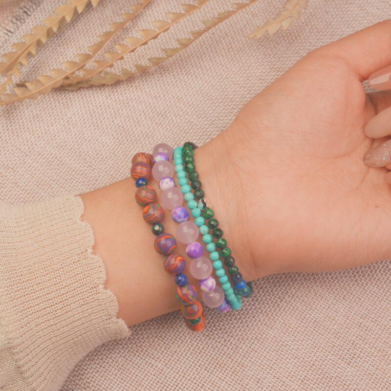 Model wearing the good luck crystal bracelet stack — a symbol of happiness, confidence, and new beginnings.